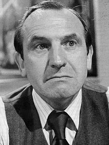 Leonard Rossiter as Reggie Perrin.jpg