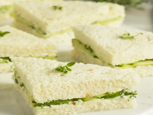 A quartered cress sandwich using white bread